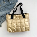 Golden quilted puffer tote bag with metallic finish and black fabric shoulder straps - Gold