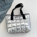 Silver quilted tote bag with black straps and shiny metallic finish on white background - Silver