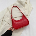 Retro red faux crocodile underarm bag with zipper closure on beige blazer - Red