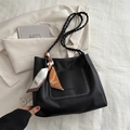 Black pebbled leather tote bag with white U-shaped stitching and floral scarf handle - Black