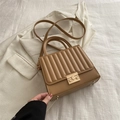 Khaki pleated leather handbag with golden metal lock and adjustable shoulder strap - Khaki