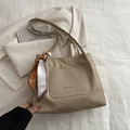 Beige lychee leather tote bag with braided handle and decorative silk scarf accessory - Khaki