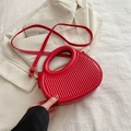 Bright red structural handbag with vertical pleats and round hollow handle for women - Red