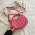 Pink pleated dumpling crossbody bag with round handle and gold hardware detail - Pink