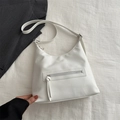 White minimalist pebbled leather shoulder bag with front zipper and long tassel detail - White