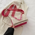 Pink straw crossbody bag with floral embroidery and wide geometric patterned shoulder strap - Pink