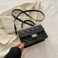 Black PU crossbody bag with triangle quilting, woven handle and gold twist lock - Black
