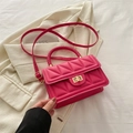 Quilted hot pink crossbody bag with gold twist lock and woven handle detail - Rose Pink