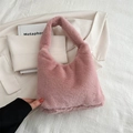 Chic pink faux fur tote bag with soft plush texture and integrated handle design - Pink