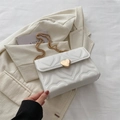 White heart quilted crossbody bag with gold heart lock and metal chain strap - White