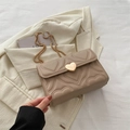 Fashionable beige heart-quilted crossbody bag with a gold heart-shaped metal twist lock - Khaki