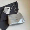 Silver metallic chain bag with envelope flap and metal bar detail on grey suit - Silver