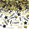Macro detail of black and gold glitter graduation confetti with cap and star shapes - Gold & Black Mix (2023)
