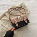 Borsa a tracolla quadrata bicolore rosa e nera con fiocco in metallo e tracolla regolabile - Rosa e Nero