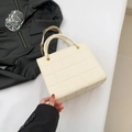 Elegant cream quilted crossbody bag with gold chain strap and dual circular handles - Off White