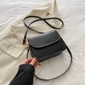 Minimalist black matte leather crossbody bag with adjustable strap and gold hardware - Black