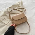 Minimalist khaki leather crossbody flap bag with adjustable strap and embossed detail - Khaki