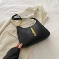 Minimalist black matte leather hobo bag with gold metal clasp and chain strap detail - Black