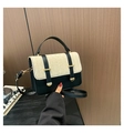 Detail of color-block handbag showing beige straw flap and black leather finish - Black