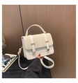 Detail of cream straw woven crossbody bag with metallic buckle and leather straps - White
