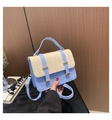 Detail of blue faux leather and beige straw woven crossbody bag with gold hardware - Blue