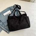 Black corduroy tote bag with dual handles, side pockets and adjustable shoulder strap - Black