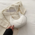 Elegant white half-moon shoulder bag with embossed heart detail and gold hardware - White