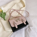 Borsa a tracolla bicolore rosa e nera con fiocco argento in stile preppy raffinato - Rosa e Nero