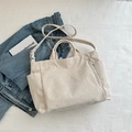 Cream white corduroy tote bag with adjustable strap and front zipper pocket - Off White