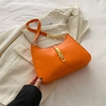 Vibrant orange hobo bag with a stylish gold buckle and a mixed leather chain strap - Orange