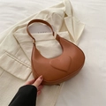 Brown half-moon underarm bag featuring embossed heart pattern and gold metal ring detail - Brown