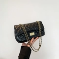 Black quilted leather shoulder bag with gold chain strap and turn-lock closure - Black
