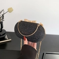 Funkelnde schwarze Glitzer Abendtasche mit goldenem Schleifenverschluss und Kette - Schwarz