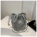 Detailed macro view of silver metallic pleated texture and drawstring on bucket bag - Silver