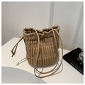 Close-up of soft pleated texture and drawstring closure on this coffee shoulder bucket bag - Khaki