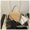 Detail of beige quilted crossbody bag with golden metal trim and sleek leather texture - Khaki