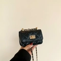Mini black quilted crossbody bag featuring a golden chain strap and classic turn-lock - Black