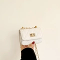 White quilted mini chain bag with gold twist lock and diamond pattern for women - Off White