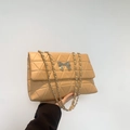 Quilted beige shoulder bag with bow-shaped metal clasp and silver chain strap details - Khaki
