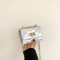 Mini silver quilted crossbody bag with golden twist lock and chain strap detail - Silver