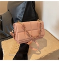 Detailed view of dusty pink quilted crossbody bag with large squares and matching chain strap - Pink
