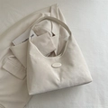 Minimalist cream white half-moon shoulder bag with smooth matte leather texture - White