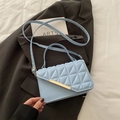 Light blue quilted flap crossbody bag with gold metal trim and slim shoulder strap - Blue
