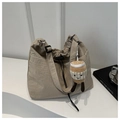 Detail of beige nylon drawstring bucket bag with cute plush coffee cup charm - Khaki With Pendant