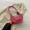 Pink croc-embossed hobo underarm bag with gold buckle on a chic blazer background - Pink