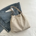 Minimalist cream drawstring tote bag with adjustable strap on blue denim backdrop - Khaki (No Pendant)
