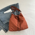 Chic brick red drawstring tote bag with adjustable strap on casual setting - Orange Without Pendant