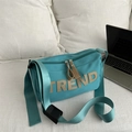 Chic light green canvas crossbody bag with TREND leather lettering and wide strap - Blue Without Charm