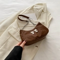 Deep brown crescent shoulder bag with silver bow accent and chain strap detail - Brown