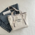 Borsa tote minimalista in tela beige con stampa FASHION BAG nera e grande capacità - Bianco